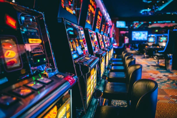 Slot game dashboard showing balance, stake, and spin history on olx123